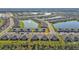 Wide aerial view of the community with lake and property location at 1530 Laurel Brook Ln, Port Charlotte, FL 33953