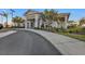Community clubhouse with white exterior and palm trees at 1530 Laurel Brook Ln, Port Charlotte, FL 33953