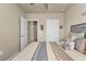 Spacious bedroom with a comfortable bed and access to the hallway at 1530 Laurel Brook Ln, Port Charlotte, FL 33953