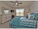 Main bedroom with a king-size bed and an ensuite bathroom at 1530 Laurel Brook Ln, Port Charlotte, FL 33953
