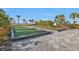 Enjoy two bocce ball courts with green artificial turf and modern gray pavers at 1530 Laurel Brook Ln, Port Charlotte, FL 33953