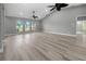 Living room with gray walls, high ceilings, and luxury vinyl plank flooring at 199 Angol St, Punta Gorda, FL 33983