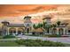 Ornate entrance to a luxury community with palm trees at 20274 Lagente Cir, Venice, FL 34293