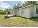 House exterior, side view, with covered patio at 2624 Lee St, Punta Gorda, FL 33950