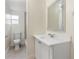 Updated bathroom with a vanity, toilet and large mirror at 2624 Lee St, Punta Gorda, FL 33950