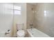 Clean bathroom with a bathtub, toilet and tile surround at 2624 Lee St, Punta Gorda, FL 33950