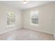 Bright bedroom with large windows and tile flooring at 2624 Lee St, Punta Gorda, FL 33950