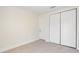 Bedroom with double door closet and tile flooring at 2624 Lee St, Punta Gorda, FL 33950