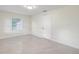 Bright bedroom with tile floors and a large window at 2624 Lee St, Punta Gorda, FL 33950