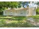 Cute single story home with a well-manicured lawn and mature trees at 2624 Lee St, Punta Gorda, FL 33950