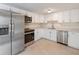 Updated kitchen, featuring stainless steel appliances and white cabinets at 2624 Lee St, Punta Gorda, FL 33950