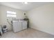 Laundry room with washer, dryer, and tile floor at 2624 Lee St, Punta Gorda, FL 33950