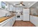 Efficient kitchen with white appliances and wood countertops at 414 San Marie Dr, Punta Gorda, FL 33950