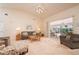 Spacious living room with vaulted ceilings and access to the lanai at 3730 Turtle Dove Blvd, Punta Gorda, FL 33950