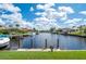 Beautiful view of a peaceful canal with boats and waterfront homes at 3730 Turtle Dove Blvd, Punta Gorda, FL 33950
