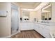 Bathroom boasts double sinks, white cabinets, and a shower at 3730 Turtle Dove Blvd, Punta Gorda, FL 33950
