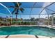 Relaxing screened-in pool with canal views and ample space for sunbathing at 3730 Turtle Dove Blvd, Punta Gorda, FL 33950