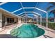 Inviting kidney-shaped pool with screened enclosure and patio at 3730 Turtle Dove Blvd, Punta Gorda, FL 33950