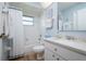 Clean bathroom featuring a tub shower, quartz vanity, and updated fixtures at 3730 Turtle Dove Blvd, Punta Gorda, FL 33950
