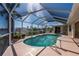 Relaxing kidney-shaped pool with screened enclosure at 3730 Turtle Dove Blvd, Punta Gorda, FL 33950