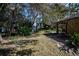 Landscaped backyard with a stone pathway at 2490 Chartwell Ave, North Port, FL 34288