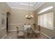 Bright dining area with a glass table and chandelier at 2490 Chartwell Ave, North Port, FL 34288