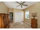 Bedroom with double door closet and ceiling fan at 2490 Chartwell Ave, North Port, FL 34288