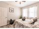 Bedroom with a brown bed frame, gray walls and window at 17084 Acapulco Rd # 222, Punta Gorda, FL 33955