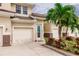 Exterior view of condo unit with garage and landscaping at 17084 Acapulco Rd # 222, Punta Gorda, FL 33955