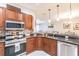Updated kitchen with stainless steel appliances and wood cabinets at 17084 Acapulco Rd # 222, Punta Gorda, FL 33955