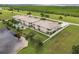Aerial view showcasing condo building's waterfront location and pool at 17084 Acapulco Rd # 222, Punta Gorda, FL 33955