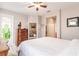 Main bedroom with wooden post bed and access to private balcony at 17084 Acapulco Rd # 222, Punta Gorda, FL 33955