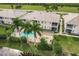 Aerial view of condo building with pool, showcasing its location near water at 17084 Acapulco Rd # 222, Punta Gorda, FL 33955