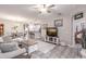 Open concept living room with a view into the kitchen and bedroom at 17084 Acapulco Rd # 222, Punta Gorda, FL 33955