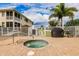 Community hot tub with surrounding patio at 17084 Acapulco Rd # 222, Punta Gorda, FL 33955