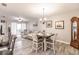 Open concept dining area with light flooring and modern decor at 17084 Acapulco Rd # 222, Punta Gorda, FL 33955