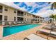 Refreshing community pool with ample lounge chairs at 17084 Acapulco Rd # 222, Punta Gorda, FL 33955