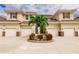 Tan colored townhouses with attached garages and landscaping at 17084 Acapulco Rd # 222, Punta Gorda, FL 33955