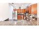 Updated kitchen featuring stainless steel appliances and wood cabinets at 17084 Acapulco Rd # 222, Punta Gorda, FL 33955