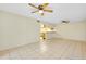 Living room with tile floors and ceiling fans at 1515 Forrest Nelson Blvd # G102, Port Charlotte, FL 33952