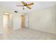 Spacious bedroom with tile floors and access to the bathroom at 1515 Forrest Nelson Blvd # G102, Port Charlotte, FL 33952