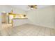 Living room with tile floors and kitchen access at 1515 Forrest Nelson Blvd # G102, Port Charlotte, FL 33952