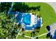 Aerial view showing the community pool with lounge chairs and landscaping at 1515 Forrest Nelson Blvd # G102, Port Charlotte, FL 33952