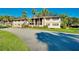 Condo building exterior with palm trees and landscaping at 1515 Forrest Nelson Blvd # G102, Port Charlotte, FL 33952