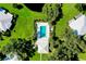 Community pool with surrounding landscaping and nearby building at 1515 Forrest Nelson Blvd # G102, Port Charlotte, FL 33952