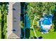 Aerial view of condo building, shuffleboard court, and pool area at 1515 Forrest Nelson Blvd # G102, Port Charlotte, FL 33952