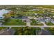 Aerial view of canal front property with lush landscaping at 15466 Seafoam Cir, Port Charlotte, FL 33981