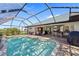 Relaxing pool area with covered patio and outdoor kitchen at 7339 Powder Puff, Punta Gorda, FL 33955