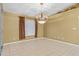 Elegant dining room featuring a chandelier and tile flooring at 3009 Brewster Rd, North Port, FL 34288