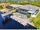 Aerial view of canal front home with pool and dock at 15650 Meacham Cir, Port Charlotte, FL 33981